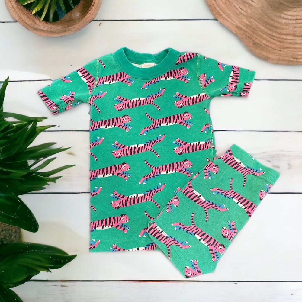Hanna Andersson pajamas: pink tigers on green background